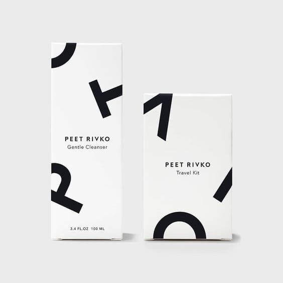 Minimal white skincare packaging with black graphic typography